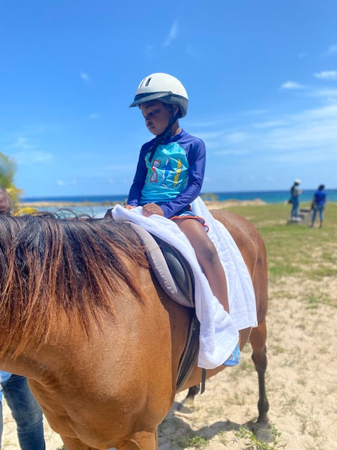 Kids doing the horse back ride excursion