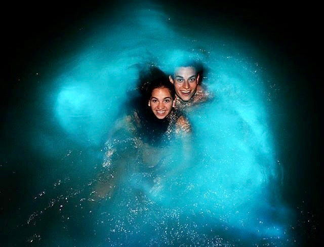 Couple glowing in the lagoon