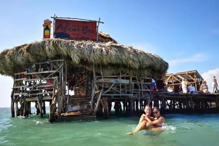 Couple swimming at the Pelican Beach Bar