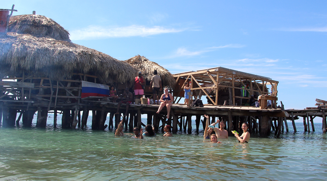 Everyone enjoying the ocean at Pelican Bar