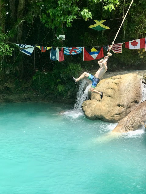 Rope swinging into the blue hole